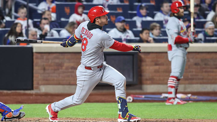 Apr 18, 2025; New York City, New York, USA;  St. Louis Cardinals third baseman Nolan Arenado (28) hits a RBI single in the sixth inning against the New York Mets at Citi Field. Mandatory Credit: Wendell Cruz-Imagn Images