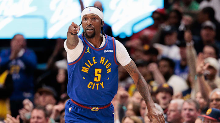 Denver Nuggets guard Kentavious Caldwell-Pope (5) reacts to a three point shot during the third quarter against the Los Angeles Lakers in game one of the first round for the 2024 NBA playoffs at Ball Arena. Denver Nuggets guard Kentavious Caldwell-Pope (5) reacts to a three point shot during the third quarter against the Los Angeles Lakers in game one of the first round for the 2024 NBA playoffs at Ball Arena.
