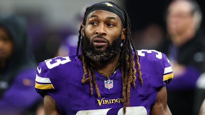 Dec 8, 2024; Minneapolis, Minnesota, USA; Minnesota Vikings running back Aaron Jones (33) looks on during the fourth quarter against the Atlanta Falcons at U.S. Bank Stadium.