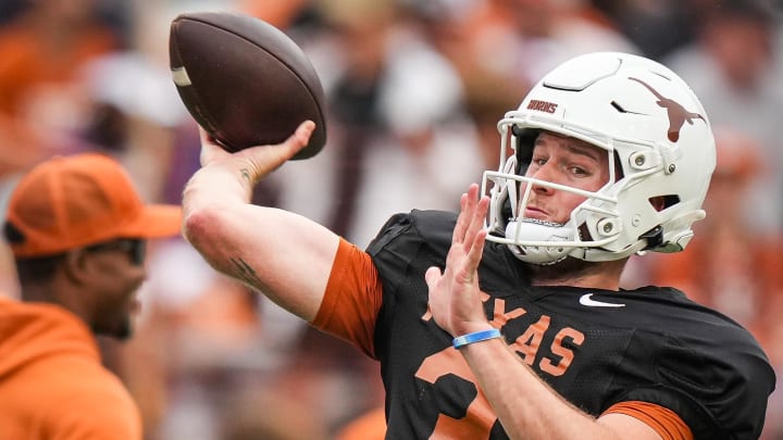 April 20, 2024; Austin, Texas, USA: Texas Longhorns quarterback Quinn Ewers (3) throws a pass while warming up ahead of the Longhorns' spring Orange and White game at Darrell K Royal Texas Memorial Stadium. Mandatory Credit: Sara Diggins-USA Today Sports via American Statesman