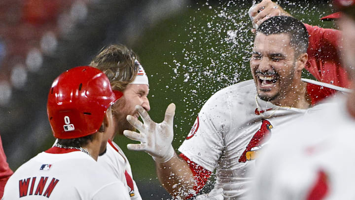 Aug 28, 2024; St. Louis, Missouri, USA;  St. Louis Cardinals third baseman Nolan Arenado (28) celebrates with shortstop Masyn Winn (0) and teammates after hitting a walk-off one run single against the San Diego Padres during the ninth inning at Busch Stadium. Mandatory Credit: Jeff Curry-Imagn Images