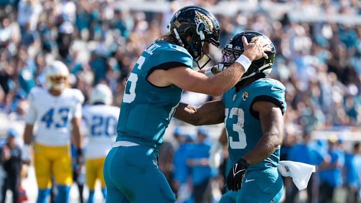 Jacksonville Jaguars quarterback Trevor Lawrence (16) congratulates Jacksonville Jaguars running back Bhayshul Tuten (33) after scoring a touchdown the first quarter in an NFL football game at EverBank Stadium, Sunday, November 16, 2025, in Jacksonville, Fla. [Doug Engle/Florida Times-Union]