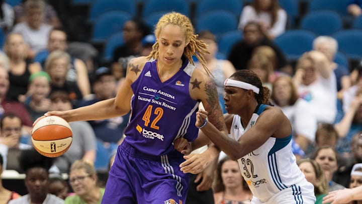 Jun 27, 2015; Minneapolis, MN, USA; Phoenix Mercury center Brittney Griner (42) dribbles in the third quarter against the Minnesota Lynx forward Rebekkah Brunson (32) at Target Center. The Minnesota Lynx beat the Phoenix Mercury 71-56.  Mandatory Credit: Brad Rempel-Imagn Images
