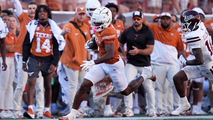 Sep 28, 2024; Austin, Texas, USA;  Texas Longhorns wide receiver Johntay Cook II (1) runs the ball in the second half against the Mississippi State Bulldogs at Darrell K Royal-Texas Memorial Stadium. Mandatory Credit: Daniel Dunn-Imagn Images