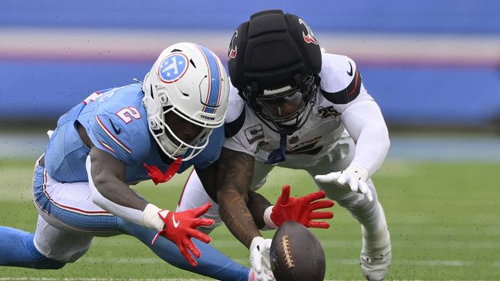 Oct 11, 2026; Nashville, Tennessee, USA; Tennessee Titans running back Tyjae Spears (2) fumbles the ball against Houston Texans safety Jalen Pitre (5) during the first half at Nissan Stadium. Mandatory Credit: Steve Roberts-Imagn Images Oct 11, 2026; Nashville, Tennessee, USA; Tennessee Titans running back Tyjae Spears (2) fumbles the ball against Houston Texans safety Jalen Pitre (5) during the first half at Nissan Stadium. Mandatory Credit: Steve Roberts-Imagn Images