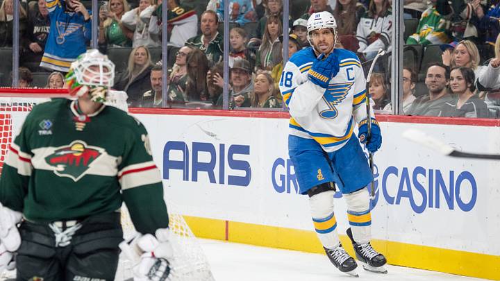 Oct 15, 2026; Saint Paul, Minnesota, USA;  St. Louis Blues center Robert Thomas (18) celebrates after scoring on Minnesota Wild goaltender Jesper Wallstedt (30) in the third period at Grand Casino Arena.  Mandatory Credit: Matt Blewett-Imagn Images