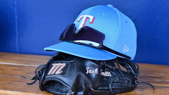 Mar 15, 2024; Salt River Pima-Maricopa, Arizona, USA; General view of a Texas Rangers hat, glove, and glasses prior to a spring training game against the Colorado Rockies at Salt River Fields at Talking Stick. 