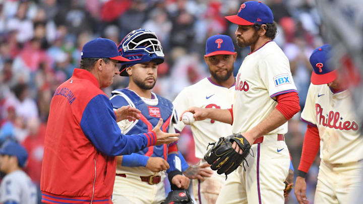 Apr 6, 2025; Philadelphia, Pennsylvania, USA; Philadelphia Phillies pitcher Jordan Romano (68) hands the ball to manager Rob Thomson (59) after being removed from the game during the seventh inning against the Los Angeles Dodgers at Citizens Bank Park.