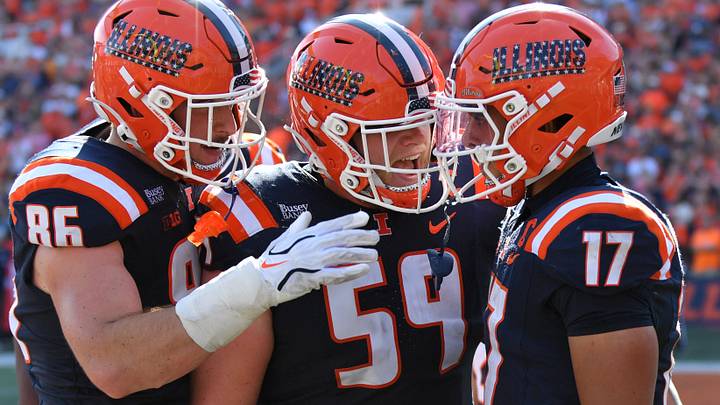 Sep 12, 2026; Champaign, Illinois, USA;  Illinois Fighting Illini tight end Christian Abney (86) and Jake Renfro (59) react with wide receiver Collin Dixon (17) after he scored a touchdown during the first half at against the Duke Blue Devils at Gies Memorial Stadium.  Mandatory Credit: Ron Johnson-Imagn Images