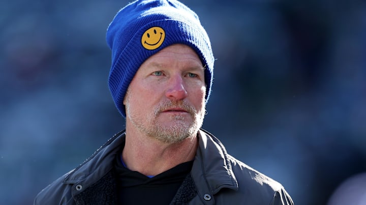 Dec 22, 2024; East Rutherford, New Jersey, USA; Los Angeles Rams general manager Les Snead watches his team warm up before a game against the New York Jets at MetLife Stadium. Mandatory Credit: Brad Penner-Imagn Images