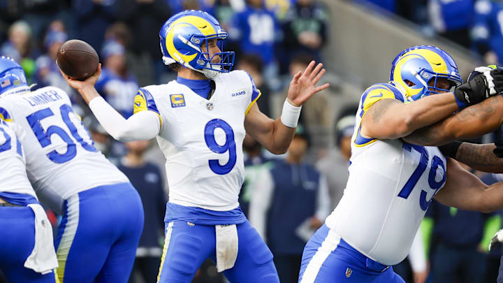 Nov 3, 2024; Seattle, Washington, USA; Los Angeles Rams quarterback Matthew Stafford (9) passes against the Seattle Seahawks during the first quarter at Lumen Field. Mandatory Credit: Joe Nicholson-Imagn Images