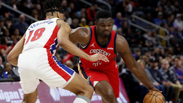 Mar 24, 2024; Detroit, Michigan, USA;  New Orleans Pelicans forward Zion Williamson (1) dribbles on Detroit Pistons forward Tosan Evbuomwan (18) in the first half at Little Caesars Arena. Mandatory Credit: Rick Osentoski-Imagn Images