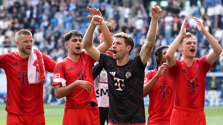 Bayern Munich players celebrate with fans after a 4-0 win against Hoffenheim on the final matchday of the Bundesliga.