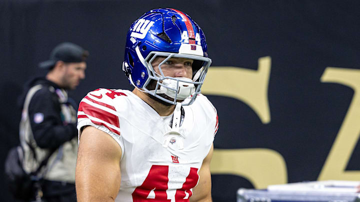 Oct 5, 2025; New Orleans, Louisiana, USA;  New York Giants running back Cam Skattebo (44) runs out the tunnel against New Orleans Saints during warmups at Caesars Superdome. Mandatory Credit: Stephen Lew-Imagn Images