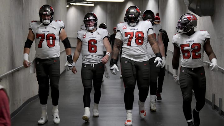 Jan 21, 2024; Detroit, Michigan, USA; (Left to right) Tampa Bay Buccaneers center Robert Hainsey