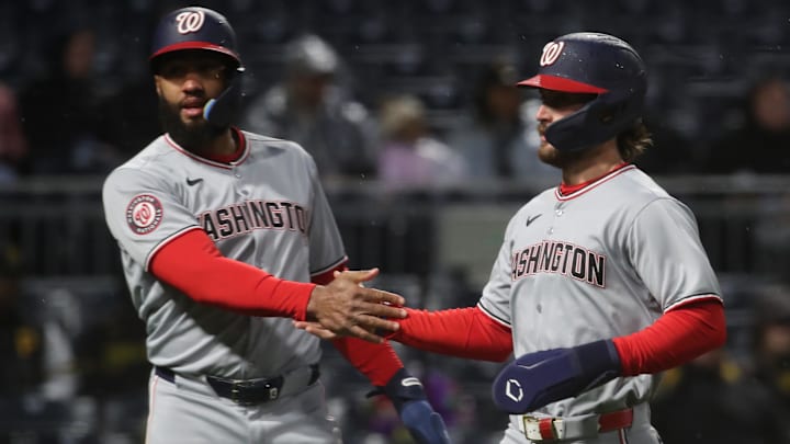 Apr 15, 2025; Pittsburgh, Pennsylvania, USA;  Washington Nationals pinch runner Amed Rosario (left) and right  fielder Dylan Crews (3) celebrate after both players scored runs against the Pittsburgh Pirates during the sixth inning at PNC Park.