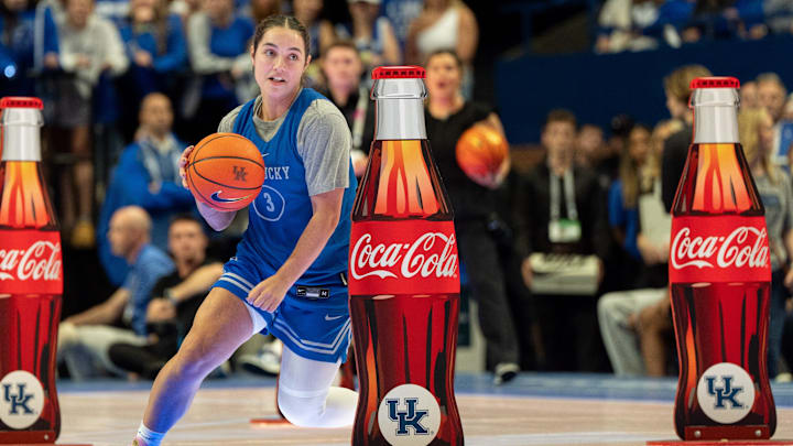 Kentucky Wildcats guard Georgia Amoore (3) weaves between obstacles during Big Blue Madness on Friday, Oct. 11, 2024 at Rupp Arena.