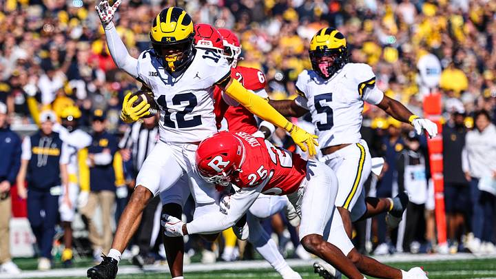 Oct 31, 2026; Piscataway, New Jersey, USA; Michigan Wolverines wide receiver Salesi Moa (12) is tackled by Rutgers Scarlet Knights defensive back JJ Conyers (25) during the first half at SHI Stadium. Mandatory Credit: Vincent Carchietta-Imagn Images Oct 31, 2026; Piscataway, New Jersey, USA; Michigan Wolverines wide receiver Salesi Moa (12) is tackled by Rutgers Scarlet Knights defensive back JJ Conyers (25) during the first half at SHI Stadium. Mandatory Credit: Vincent Carchietta-Imagn Images