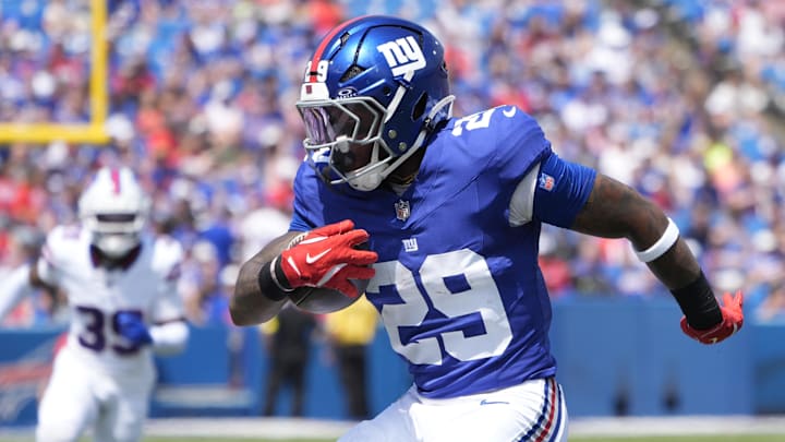 New York Giants running back Tyrone Tracy Jr. (29) runs with the ball against the Buffalo Bills during the first half at Highmark Stadium. 