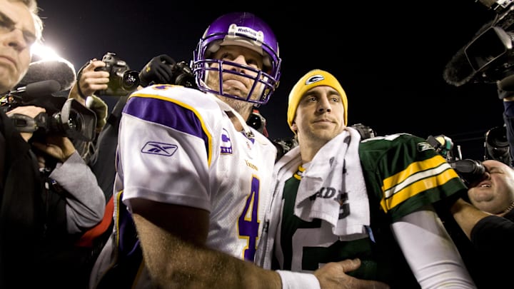 Nov 1, 2009; Green Bay, WI, USA; Minnesota Vikings quarterback Brett Favre (4) greets Green Bay Packers quarterback Aaron Rodgers (12) following the game at Lambeau Field. The Vikings defeated the Packers 38-26. Nov 1, 2009; Green Bay, WI, USA; Minnesota Vikings quarterback Brett Favre (4) greets Green Bay Packers quarterback Aaron Rodgers (12) following the game at Lambeau Field. The Vikings defeated the Packers 38-26.