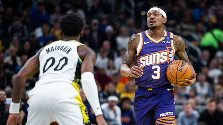 Jan 4, 2025; Indianapolis, Indiana, USA; Phoenix Suns guard Bradley Beal (3) dribbles the ball against Indiana Pacers guard Bennedict Mathurin (00) in the first half at Gainbridge Fieldhouse. Mandatory Credit: Trevor Ruszkowski-Imagn Images Jan 4, 2025; Indianapolis, Indiana, USA; Phoenix Suns guard Bradley Beal (3) dribbles the ball against Indiana Pacers guard Bennedict Mathurin (00) in the first half at Gainbridge Fieldhouse. Mandatory Credit: Trevor Ruszkowski-Imagn Images