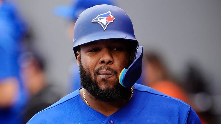 Blue Jays designated hitter Vladimir Guerrero Jr. (27) reacts in the dugout after striking out. Credit: John E. Sokolowski-Imagn 