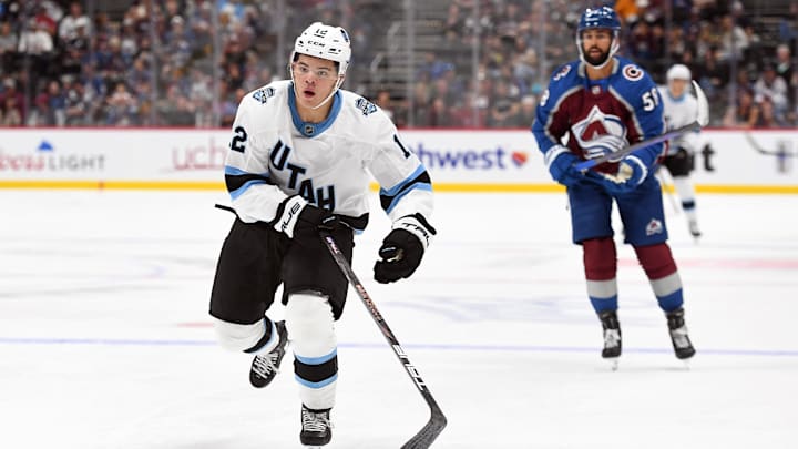 Sep 29, 2024; Denver, Colorado, USA; Utah Hockey Club orward Tij Iginla (12) skates toward an iced puck during the first period against the Colorado Avalanche at Ball Arena. Mandatory Credit: Christopher Hanewinckel-Imagn Images
