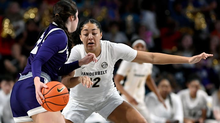 Lipscomb guard Addison Melton, left, is defended by Vanderbilt forward Khamil Pierre (12) during an NCAA college basketball game Monday, Nov. 4, 2024, in Nashville, Tenn.