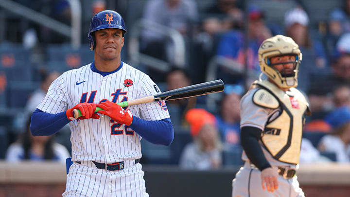 May 26, 2025; New York City, New York, USA; New York Mets right fielder Juan Soto (22) reacts after striking out during the fourth inning as Chicago White Sox catcher Edgar Quero (7) looks back at Citi Field. Mandatory Credit: Vincent Carchietta-Imagn Images
