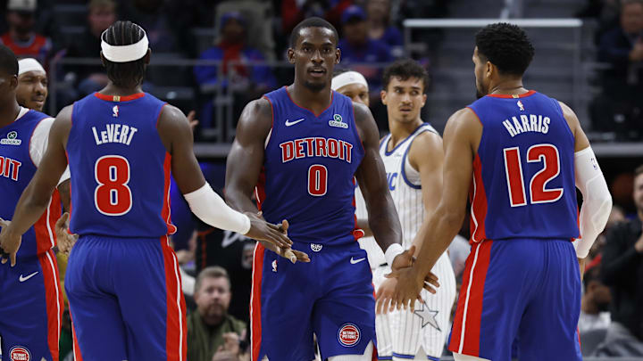 Oct 29, 2025; Detroit, Michigan, USA; Detroit Pistons center Jalen Duren (0) receives congratulations from guard Caris LeVert (8) and forward Tobias Harris (12) in the first half against the Orlando Magic at Little Caesars Arena. Mandatory Credit: Rick Osentoski-Imagn Images