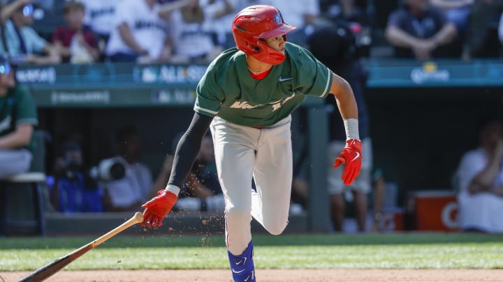 Jul 8, 2023; Seattle, Washington, USA; National League Futures designated hitter Justin Crawford (13) of the Philadelphia Phillies hits an RBI-sacrifice fly against the American League Futures during the second inning of the All Star-Futures Game at T-Mobile Park. Jul 8, 2023; Seattle, Washington, USA; National League Futures designated hitter Justin Crawford (13) of the Philadelphia Phillies hits an RBI-sacrifice fly against the American League Futures during the second inning of the All Star-Futures Game at T-Mobile Park.
