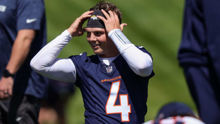 May 23, 2024; Englewood, CO, USA; Denver Broncos quarterback Zach Wilson (4) during organized team activities at Centura Health Training Center. Mandatory Credit: Isaiah J. Downing-USA TODAY Sports