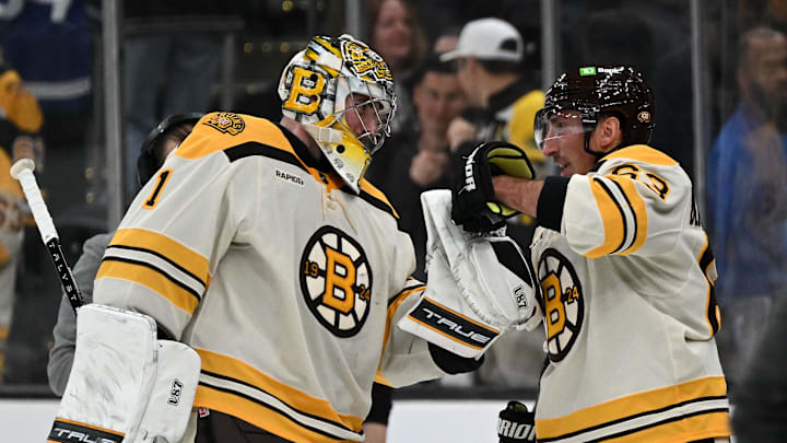 Nov 2, 2023; Boston, Massachusetts, USA; Boston Bruins left wing Brad Marchand (63) celebrates with goaltender Jeremy Swayman (1) after an overtime win against the Toronto Maple Leafs at the TD Garden. Mandatory Credit: Brian Fluharty-Imagn Images