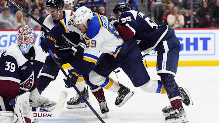 Mar 29, 2025; Denver, Colorado, USA; St. Louis Blues left wing Pavel Buchnevich (89) scores on Colorado Avalanche goaltender Mackenzie Blackwood (39) as Colorado Avalanche center Martin Necas (88) and defenseman Ryan Lindgren (55) defend in the third period at Ball Arena. Mandatory Credit: Ron Chenoy-Imagn Images