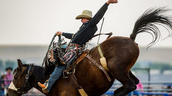 Dawson Hay makes an 84.5 point ride in the saddle bronc event during the Big Sky Pro Rodeo on Friday at the Montana State Fair. Dawson Hay makes an 84.5 point ride in the saddle bronc event during the Big Sky Pro Rodeo on Friday at the Montana State Fair.