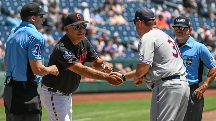 Jun 20, 2022; Omaha, NE, USA; Stanford Cardinal head coach David Esquer and Auburn Tigers head coach Butch Thompson meet before the game at Charles Schwab Field. Mandatory Credit: Steven Branscombe-Imagn Images Jun 20, 2022; Omaha, NE, USA; Stanford Cardinal head coach David Esquer and Auburn Tigers head coach Butch Thompson meet before the game at Charles Schwab Field. Mandatory Credit: Steven Branscombe-Imagn Images