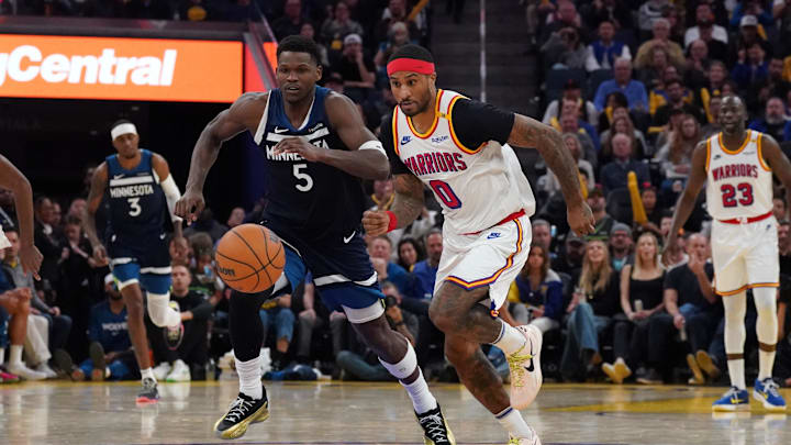 Dec 8, 2024; San Francisco, California, USA; Minnesota Timberwolves guard Anthony Edwards (5) and Golden State Warriors guard Gary Payton II (0) chase a loose ball in the fourth period at Chase Center. 