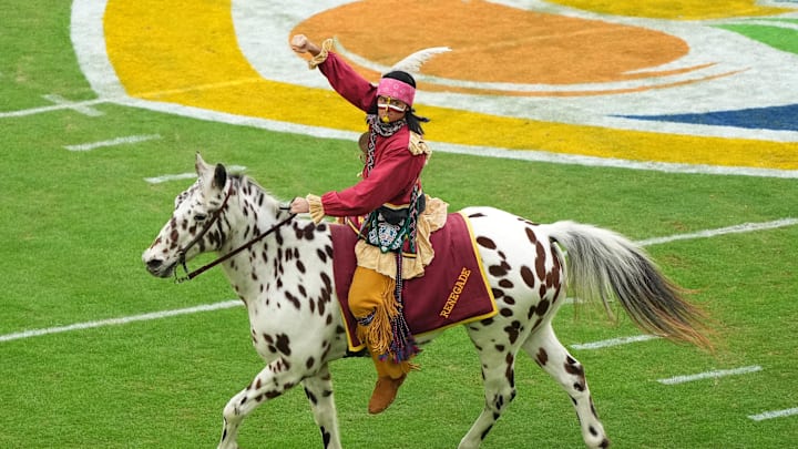 Dec 30, 2023; Miami Gardens, FL, USA; Florida State Seminoles mascot Chief Osceola and Renegade take the field before the game in the 2023 Orange Bowl against the Georgia Bulldogs at Hard Rock Stadium. Mandatory Credit: Jasen Vinlove-Imagn Images