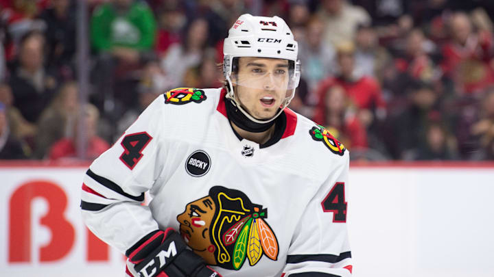 Mar 28, 2024; Ottawa, Ontario, CAN; Chicago Blackhawks defenseman Wyatt Kaiser (44) follows the puck in the first period against the Ottawa Senators at the Canadian Tire Centre. Mandatory Credit: Marc DesRosiers-Imagn Images