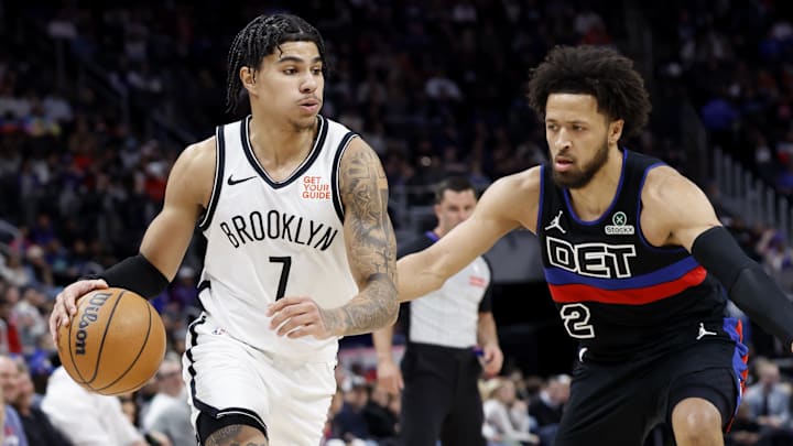 Mar 1, 2025; Detroit, Michigan, USA;  Brooklyn Nets guard Killian Hayes (7) dribbles defended by Detroit Pistons guard Cade Cunningham (2) in the first half at Little Caesars Arena. Mandatory Credit: Rick Osentoski-Imagn Images