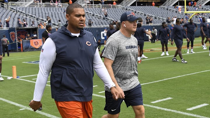 Aug 26, 2023; Chicago, Illinois, USA;  Chicago Bears General Manager Ryan Poles, left, and Luke Getsy, Offensive Coordinator walk the field  before the team s game against the Buffalo Bills at Soldier Field. Mandatory Credit: Matt Marton-Imagn Images