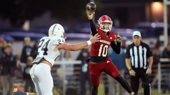 Washington's Creed Barrett throws a pass as Marlow's Korbin Dittner defends during the high school football game between Washington and Marlow at Washington High School in Washington, Okla., Thursday, Oct., 17, 2024.