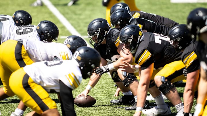 Apr 26, 2025; Iowa City, IA, USA; Iowa offensive lineman Josh Janowski (63) gets set to snap the ball during a spring NCAA football open practice at Kinnick Stadium. Mandatory Credit: Joseph Cress/For the Register