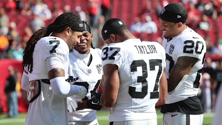 Dec 8, 2024; Tampa, Florida, USA; Las Vegas Raiders safety Tre'von Moehrig (7), safety Thomas Harper (34), safety Trey Taylor (37) and safety Isaiah Pola-Mao (20) prior to the game against the Tampa Bay Buccaneers at Raymond James Stadium. Mandatory Credit: Kim Klement Neitzel-Imagn Images