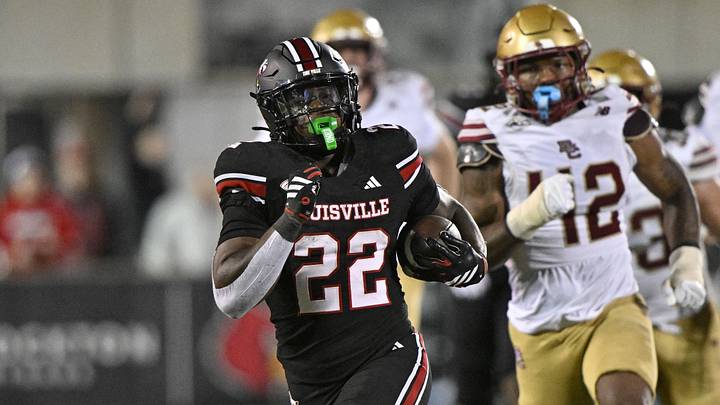 Oct 25, 2025; Louisville, Kentucky, USA;  Louisville Cardinals running back Keyjuan Brown (22) runs the ball for a touchdown against the Boston College Eagles during the second half at L&N Federal Credit Union Stadium.  Mandatory Credit: Jamie Rhodes-Imagn Images