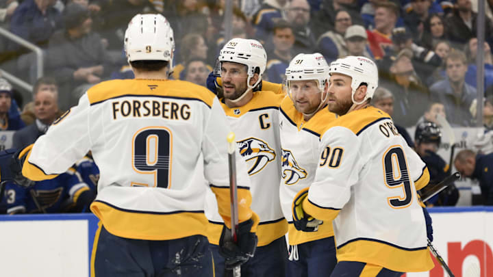 Dec 27, 2024; St. Louis, Missouri, USA; Nashville Predators center Steven Stamkos (91) is congratulated by teammates after scoring a goal against the St. Louis Blues during the first period at Enterprise Center. Mandatory Credit: Jeff Le-Imagn Images