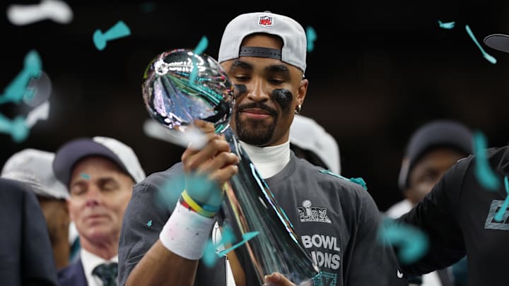 Feb 9, 2025; New Orleans, LA, USA; Philadelphia Eagles quarterback Jalen Hurts holds the Lombardi Trophy during the championship trophy presentation after the Eagles' game against the Kansas City Chiefs in Super Bowl LIX at Caesars Superdome. Mandatory Credit: Geoff Burke-Imagn Images