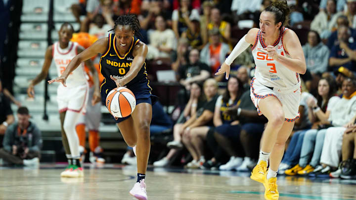 Aug 17, 2025; Uncasville, Connecticut, USA; Indiana Fever guard Kelsey Mitchell (0) returns the ball against Connecticut Sun guard Marina Mabrey (3) in the second half at Mohegan Sun Arena. Mandatory Credit: David Butler II-Imagn Images