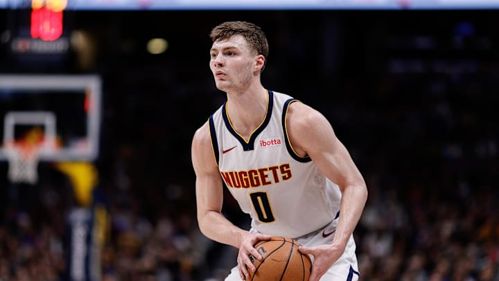 Feb 4, 2024; Denver, Colorado, USA; Denver Nuggets guard Christian Braun (0) controls the ball 