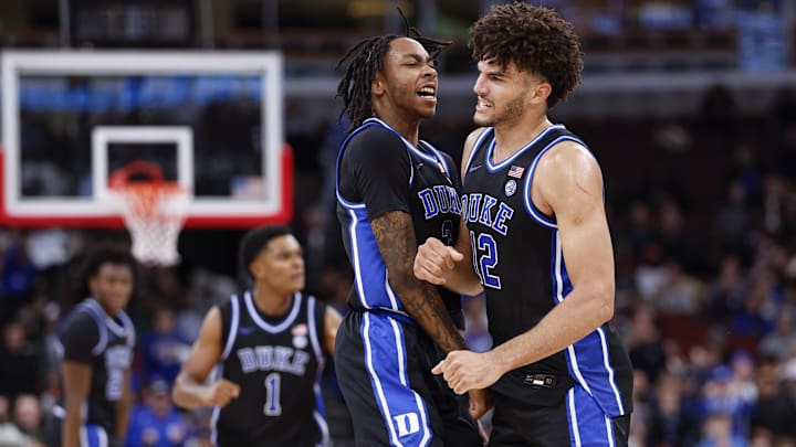 Nov 27, 2025; Chicago, Illinois, USA; Duke Blue Devils forward Cameron Boozer (12) celebrates with guard Isaiah Evans (3) during the second half at United Center. Mandatory Credit: Kamil Krzaczynski-Imagn Images Nov 27, 2025; Chicago, Illinois, USA; Duke Blue Devils forward Cameron Boozer (12) celebrates with guard Isaiah Evans (3) during the second half at United Center. Mandatory Credit: Kamil Krzaczynski-Imagn Images